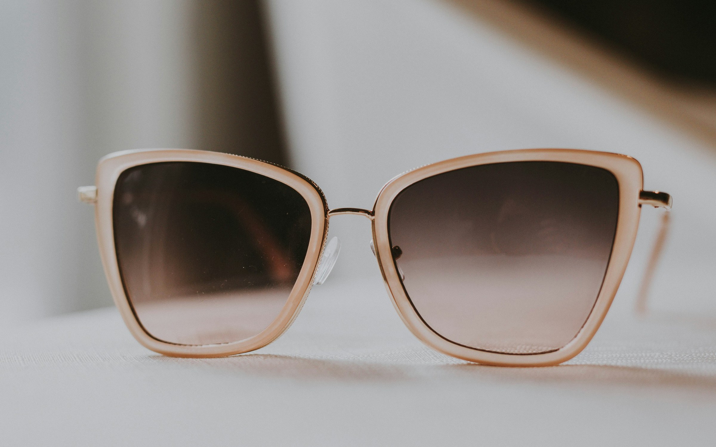 Luxury sunglasses in a sunlit editorial